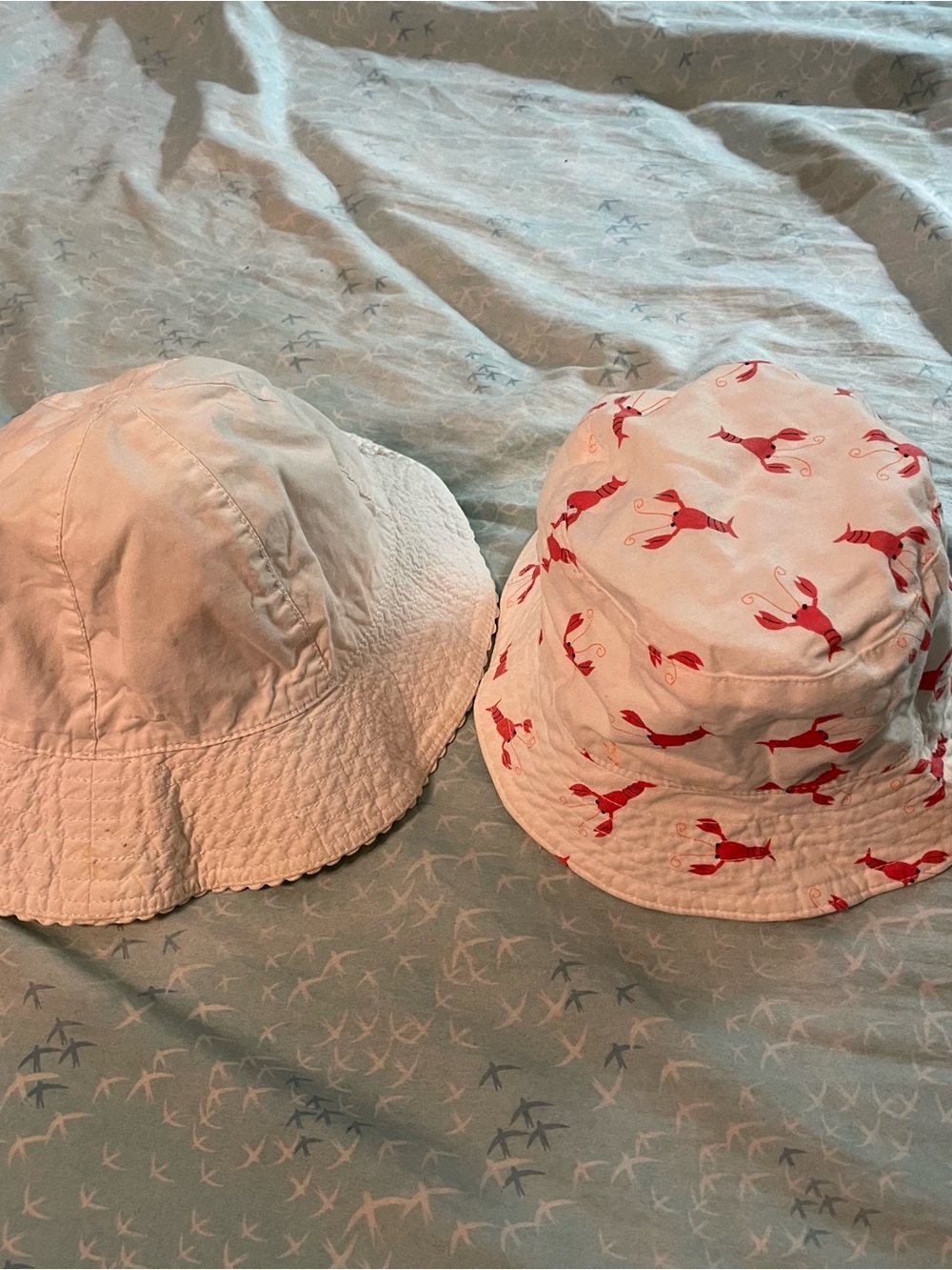 2 Kids White Bucket Hats, one with Red Lobster Print